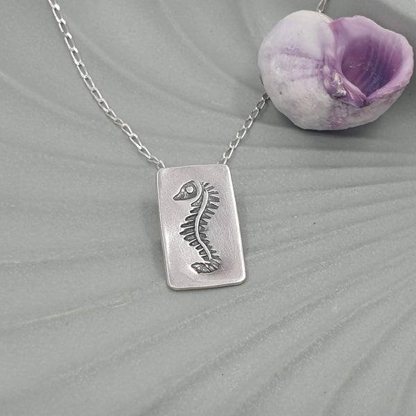 hand stamped seahorse necklace