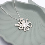 octopus necklace with mid blue eyes
