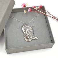 ornate elephant necklace with gemstone