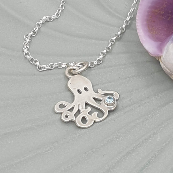 octopus with pale blue stone necklace
