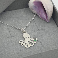 octopus with green stone necklace
