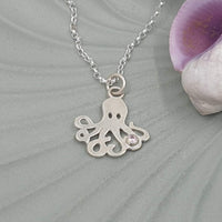 octopus with pale pink stone necklace