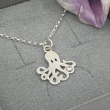 octopus with pale pink stone necklace