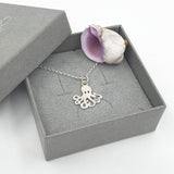 octopus with purple stone necklace