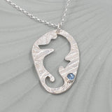 Open seahorse necklace with Blue gemstone