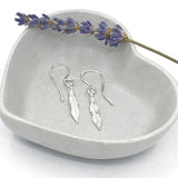 silver feather drop earrings
