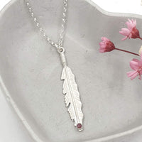 feather necklace with red pink ruby gemstone