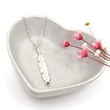 feather necklace with red pink ruby gemstone