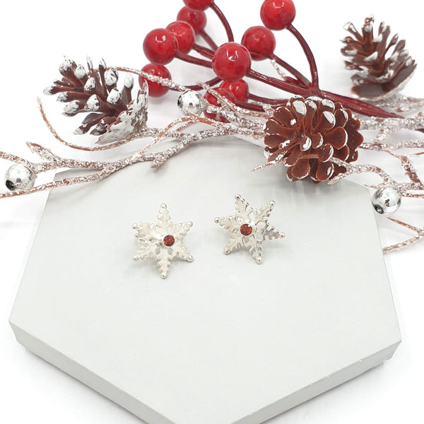 snowflake stud earrings with garnets
